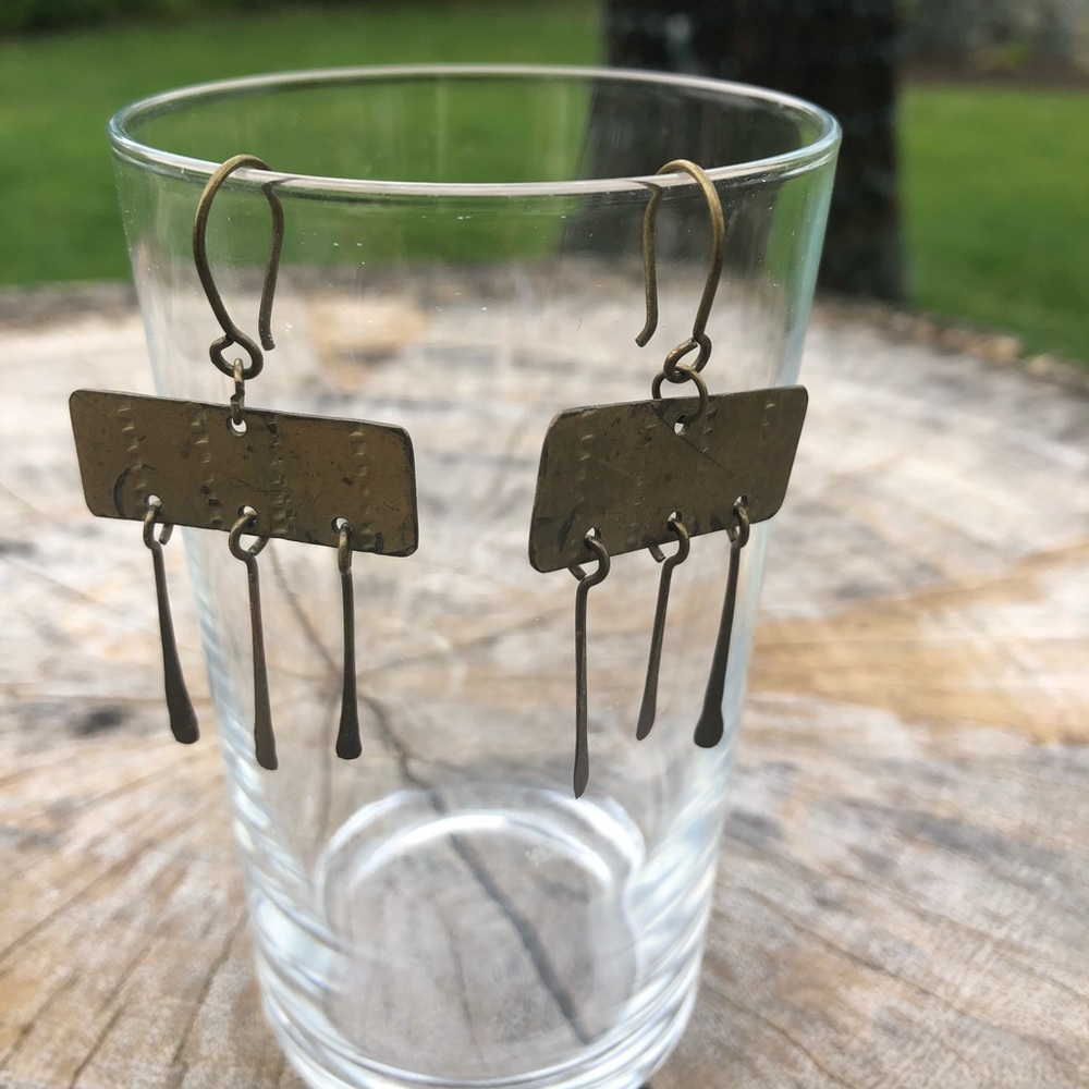 Brass dangle earrings.